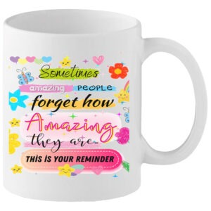 White ceramic positivity mug with colourful text reading “Sometimes Amazing People Forget How Amazing They Are – This Is Your Reminder”, decorated with hearts, stars, flowers and rainbow doodles