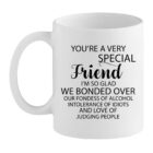 White mug with bold black text reading “You’re a very special friend… we bonded over alcohol, intolerance of idiots and judging people.”
